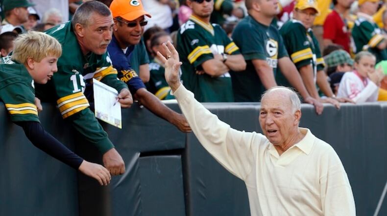 FILE - In this Sept. 10, 2012, file photo, former Green Bay Packers quarterback Bart Starr waves to fans during the Packers' NFL football game against the San Francisco 49ers in Green Bay, Wis. Starr's family says the Hall of Fame quarterback is recovering after breaking his hip just before Christmas. (AP Photo/Jeffrey Phelps, File)