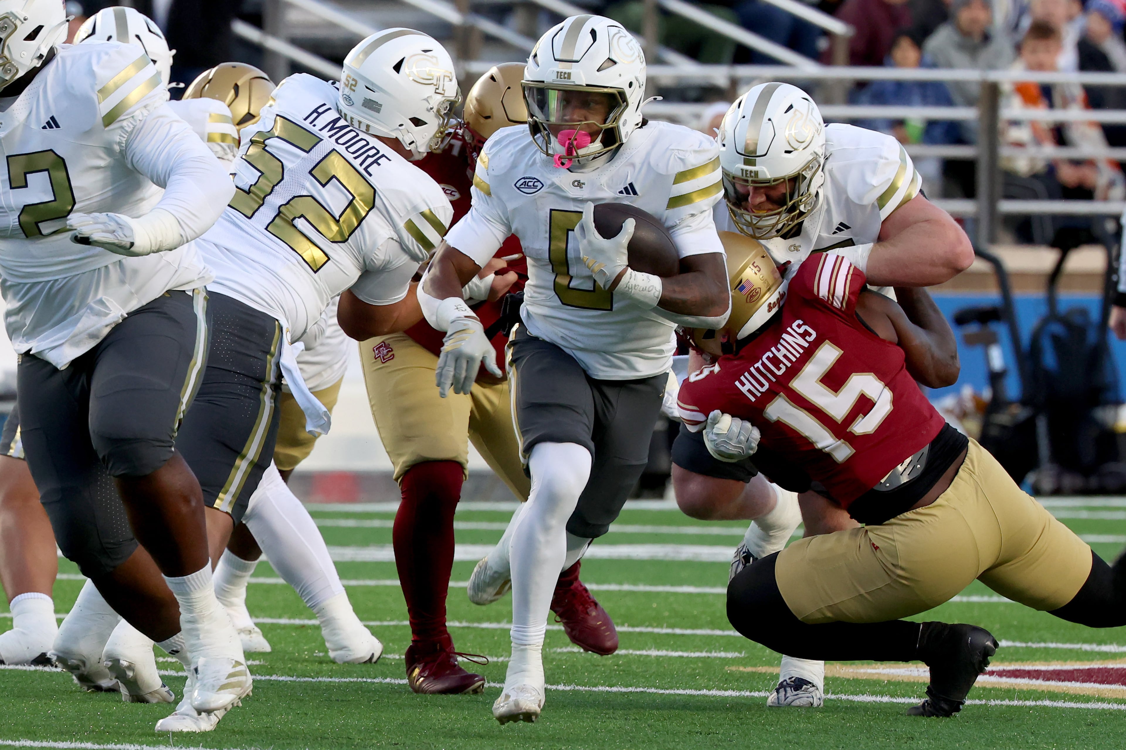 Georgia Tech running back Malachi Hosley, center, runs the ball during the first half of an NCAA college football game against Boston College, Saturday, Nov. 15, 2025, in Boston. (AP Photo/Mark Stockwell)
