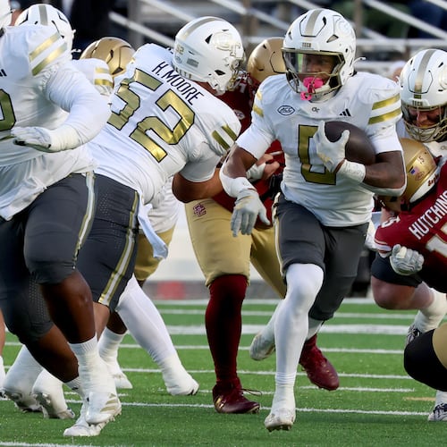 Georgia Tech running back Malachi Hosley, center, runs the ball during the first half of an NCAA college football game against Boston College, Saturday, Nov. 15, 2025, in Boston. (AP Photo/Mark Stockwell)