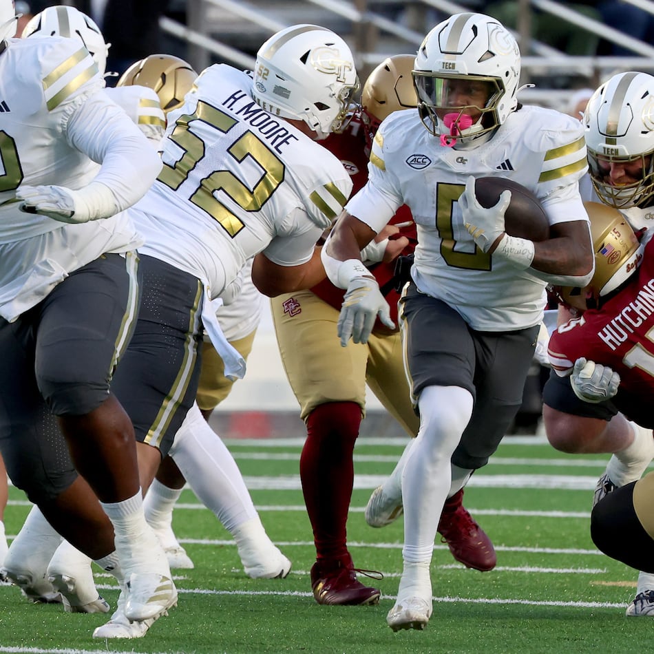 Georgia Tech running back Malachi Hosley, center, runs the ball during the first half of an NCAA college football game against Boston College, Saturday, Nov. 15, 2025, in Boston. (AP Photo/Mark Stockwell)