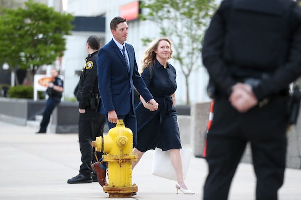 Former Grand Rapids City Police officer Christopher Schurr and wife Brandey arrive outside the Kent County Courthouse on the first day of testimony in his 2nd degree murder trial in Grand Rapids, Mich., Monday, April 28, 2025. (Chris duMond/Detroit News via AP)