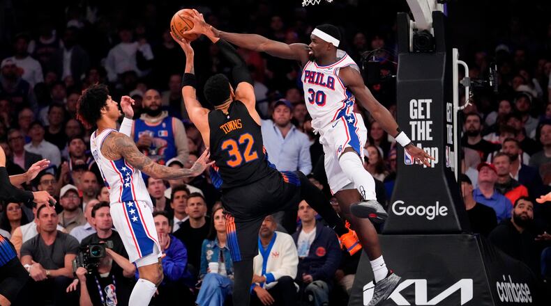 Philadelphia 76ers center Adem Bona (30) blocks New York Knicks center Karl-Anthony Towns (32) during the second half of Game 2 in a second-round NBA basketball playoffs series, Wednesday, May 6, 2026, in New York. (AP Photo/Yuki Iwamura)