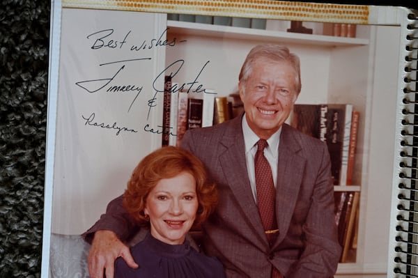 Sally Mae Hollis made a scrapbook with photos of her Habitat home built by Jimmy and Rosalynn Carter, as well as many other volunteers, in 1988 on Foote Street in Atlanta. Neighbors in the 20-home cluster in the Edgewood section of Atlanta used to live in run-down apartments and rented homes, and grew weary of raising families where there was so much crime and drugs. (Hyosub Shin/AJC 2023)
