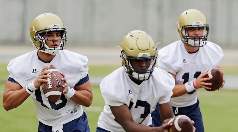 Georgia Tech quarterbacks from left, Lucas Johnson, Jay Jones and Matthew Jordan run a drill during an NCAA college football practice in Atlanta, Monday, March 27, 2017. Coming off a nine-win season, Georgia Tech begins spring football practice Monday with all eyes on the quarterback position after the departure of three-year starter Justin Thomas. (AP Photo/David Goldman)