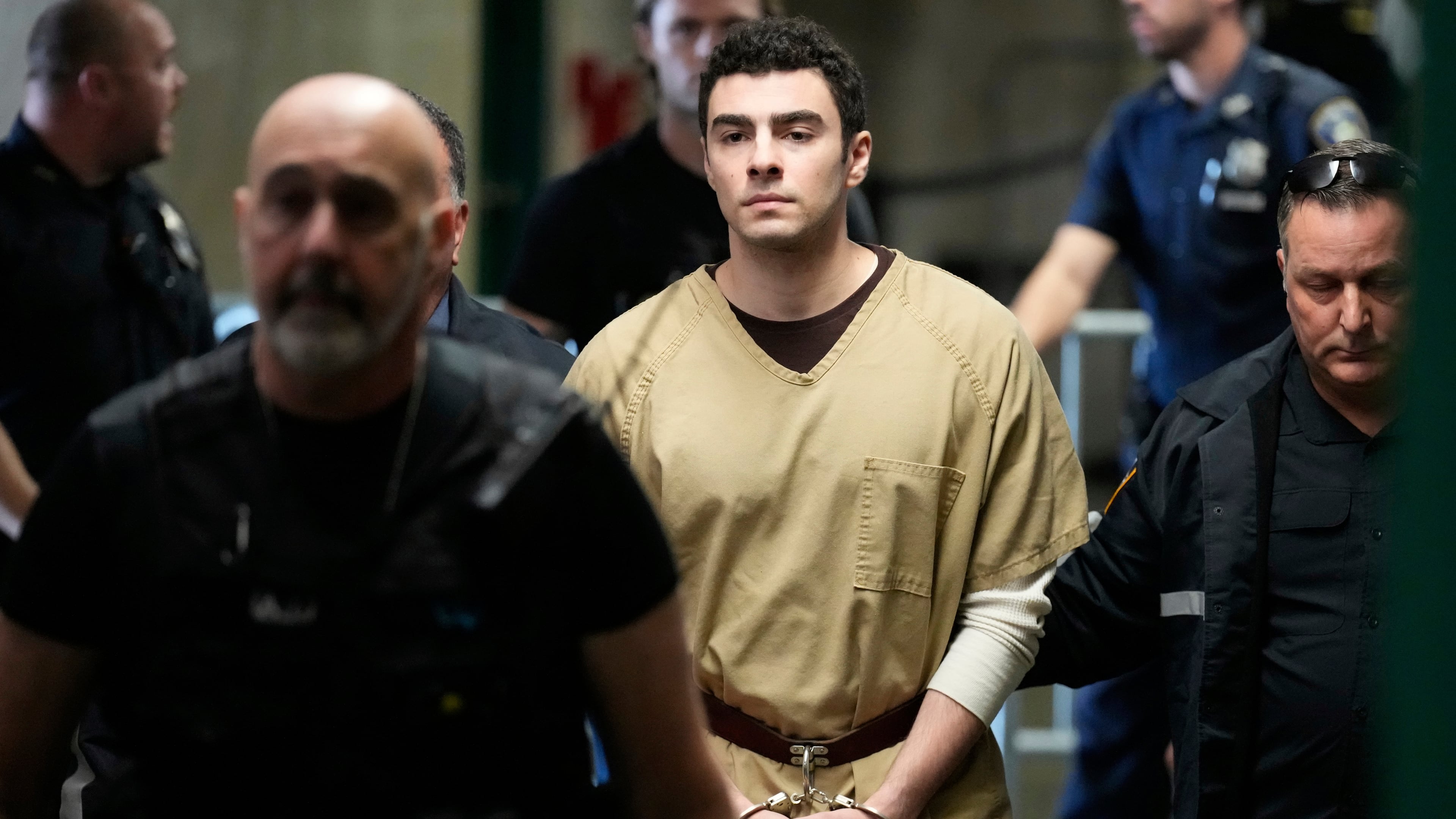 Luigi Mangione is escorted into Manhattan state court in New York, Tuesday, Sept. 16, 2025. (AP Photo/Seth Wenig)