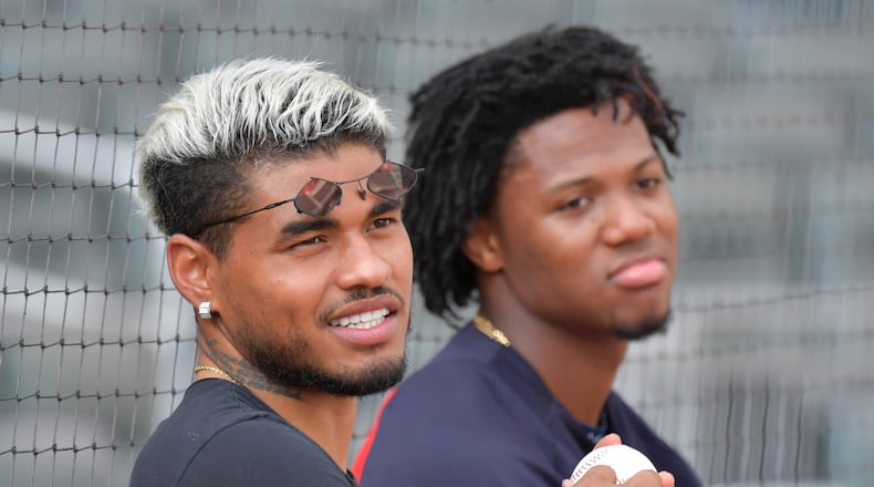 Prior to Game One of last season's NLDS against St. Louis Atlanta United striker Josef Martinez (left) confers with Braves outfielder Ronald Acuna Jr. (Hyosub Shin / Hyosub.Shin@ajc.com)