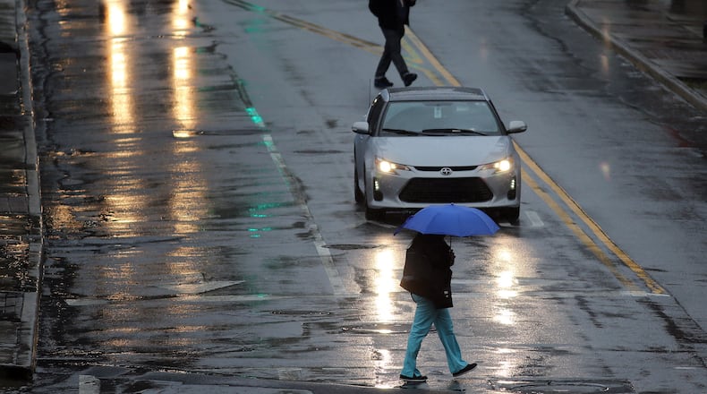Atlanta will remain damp through the weekend, with cooler temperatures forecast. BEN GRAY / BGRAY@AJC.COM