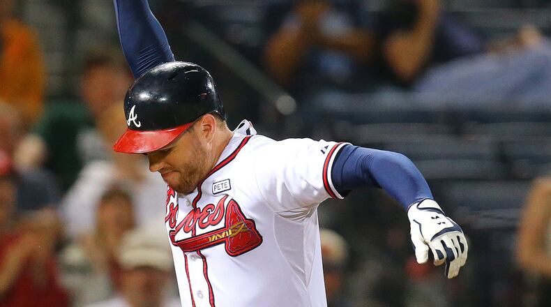 Atlanta Braves' Freddie Freeman, thinking he drew a walk, slams his bat down on the ground in anger, shattering it, after homeplate umpire Tim Timmons called him out during the sixth inning of their game against the Washington Nationals on Monday, Sept. 15, 2014, at Turner Field in Atlanta. Freeman and Braves manager Fredi Gonzalez were both ejected from the game for arguing the call. (Curtis Compton/Atlanta Journal-Constitution/MCT) Freddie Freeman and Braves have had reason to be angry, and another may be coming tonight. (Curtis Compton/AJC)