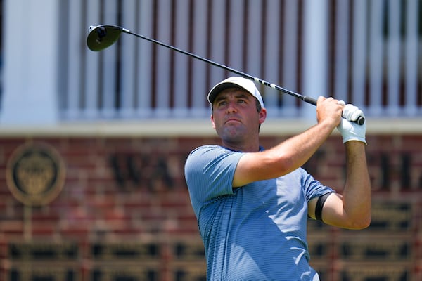 Scottie Scheffler watches his tee shot on the first hole during the first round of the Charles Schwab Challenge golf tournament at Colonial Country Club in Fort Worth, Texas, Thursday, May 22, 2025. (AP Photo/Julio Cortez)