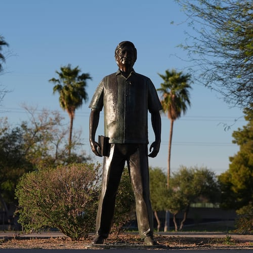 FILE - A statute of César Chavez stands in the middle of a plaza at Cesar Chavez Park, honoring the United Farm Workers union founder, March 18, 2026, in Laveen, Ariz. (AP Photo/Ross D. Franklin, File)