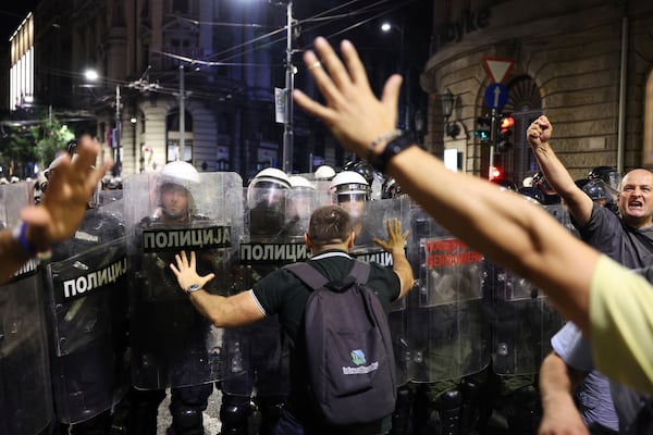 Riot police take positions on a street during a major anti-government rally pressing for an early election after nearly eight months of almost daily anti-corruption demonstrations that have shaken the populist government of President Aleksandar Vucic, in Belgrade, Serbia, Saturday, June 28, 2025. (AP Photo/Marko Drobnjakovic)