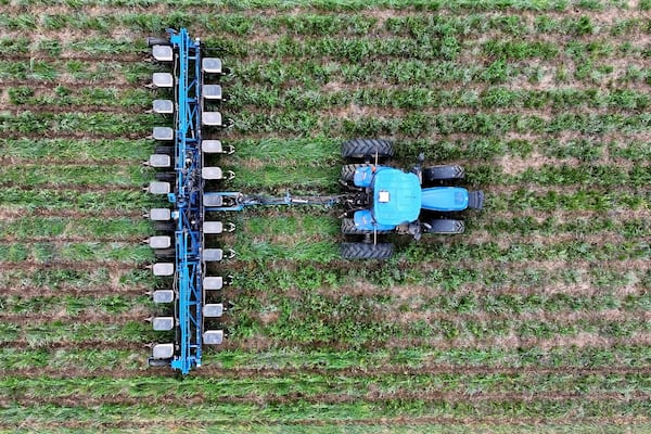 In this image from video provided by Matt Griggs, a tractor plants seeds in the ground on April 21, 2025 on the farm of Matt Griggs in Humboldt, Tenn. Griggs, like many American farmers, is paying close attention to the trade war between the U.S. and China, a critical market for soybeans. (Matt Griggs via AP)
