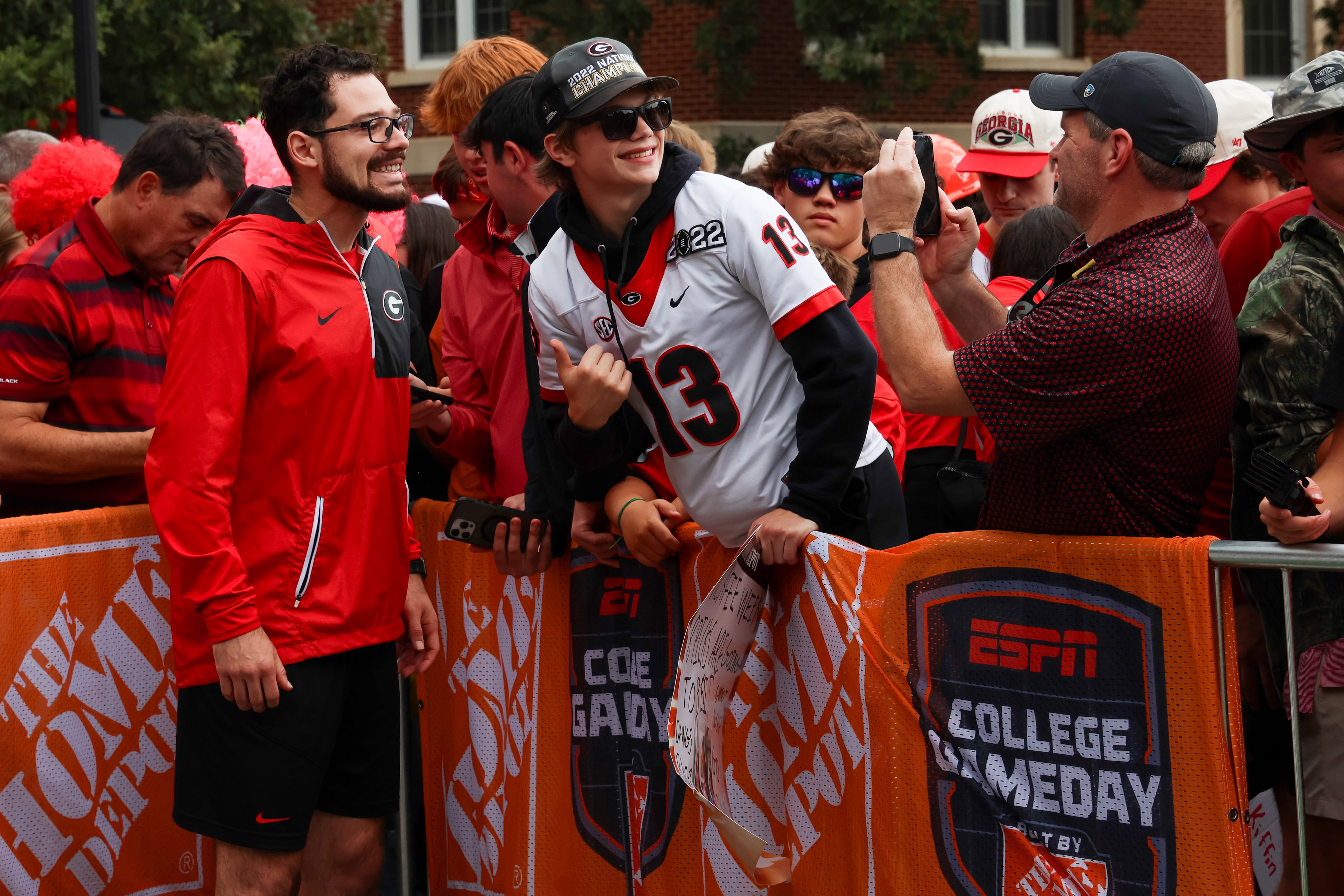 Former UGA kicker Rodrigo Blankenship (left) takes a photo with a fan during the ESPN College GameDay broadcast from Myers Quad at UGA on Saturday, Oct. 18, 2025. (C.J. Bartunek for the AJC)