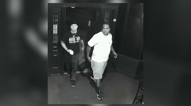 Authorities on Thursday released surveillance footage that shows the man outside the Sportstime Bar and Grille on the night of the shooting. They hope to talk to the man in the white T-shirt.