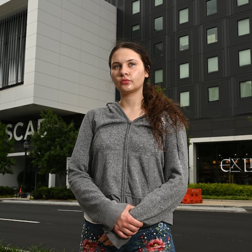 Dream Hain, a freshman at the Savannah College of Art and Design, stands outside her new dormitory building, SCAD’s Forty Five residence, on Friday, May 1, 2026, in Atlanta. Hain lost nearly all her belongings when a fire in a different dorm led to smoke and water damage to rooms throughout that building. (Hyosub Shin/AJC)