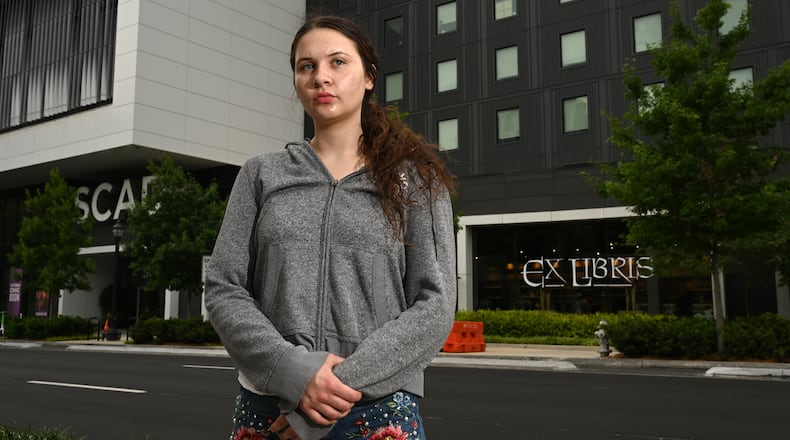 Dream Hain, a freshman at the Savannah College of Art and Design, stands outside her new dormitory building, SCAD’s Forty Five residence, on Friday, May 1, 2026, in Atlanta. Hain lost nearly all her belongings when a fire in a different dorm led to smoke and water damage to rooms throughout that building. (Hyosub Shin/AJC)