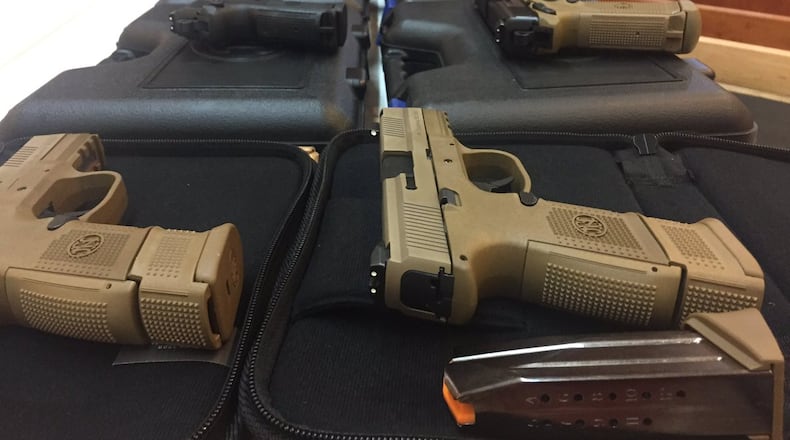 These guns allegedly were stolen by a UPS driver in Gwinnett County. (Credit: Channel 2 Action News)