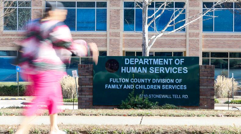 A person walks in front of the Department of Human Services, Division of Family & Children Services, South Fulton, on Sunday, Nov 23, 2025. (Miguel Martinez/AJC)
