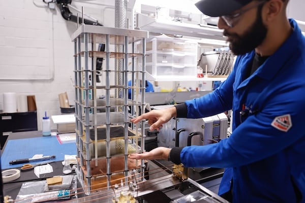 Jeet Maniktala, JTEC Energy’s engineering team lead, shows off a prototype "stack" at the company’s headquarters on Wednesday, Oct. 29, 2025, in Atlanta. The unit is a key part of the device created by Lonnie Johnson, which converts heat into usable electricity. (Natrice Miller/AJC)