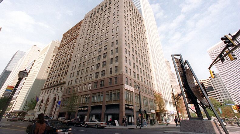 Police are seeking a man suspected of shooting another man after a dispute near the historic William Oliver Building in downtown Atlanta.