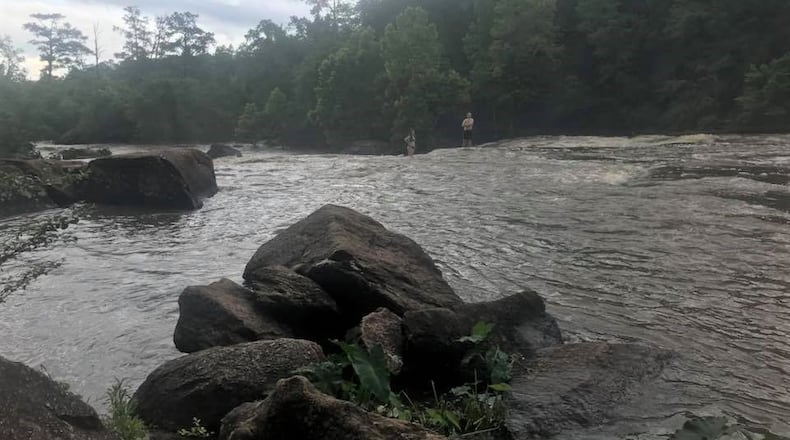 Two 17-year-old swimmers are rescued from the Towaliga River at High Falls State Park Tuesday night after they became stranded.