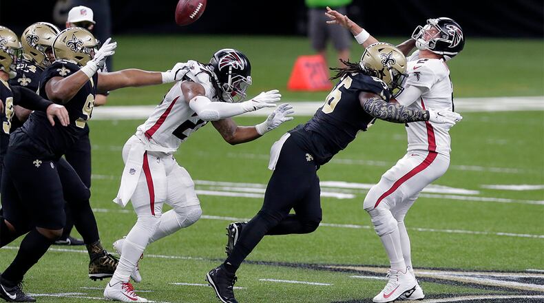 Falcons quarterback Matt Ryan (2) is hit by Saints outside linebacker Demario Davis (56) in the first half Sunday, Nov. 22, 2020, in New Orleans. (Brett Duke/AP)