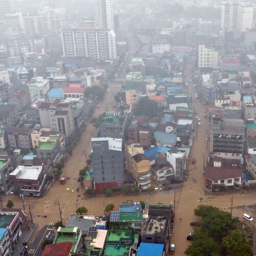 The partly flooded street by heavy rain is seen in Geoje, South Korea, Monday, Aug. 17, 2026. (Kim Dong-min/Yonhap via AP)