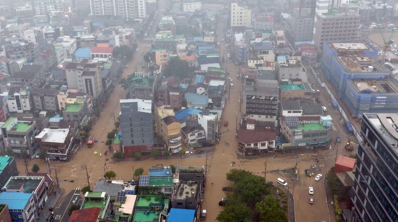 The partly flooded street by heavy rain is seen in Geoje, South Korea, Monday, Aug. 17, 2026. (Kim Dong-min/Yonhap via AP)