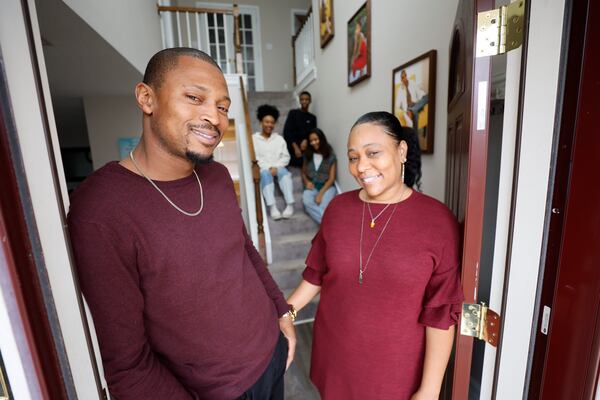 Eric and Oriana Wyche, seen last month at their Jonesboro home, had to compete with investors in their search. Oriana said with every rejected bid, she got a similar answer. "A lot of them told me it went to an investor who could close sooner, who could put more money down," she said. "You just couldn't compete." (Miguel Martinez / miguel.martinezjimenez@ajc.com)