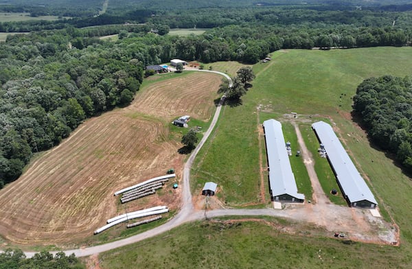 Aerial photo shows the property of Banks County Sheriff Carlton Speed, Wednesday, May 21, 2025, in Carnesville. The boundary between Banks and Franklin mysteriously moved to the east, allowing the Banks sheriff to claim he lives in the county and keep his job as the top lawman. The boundary between Banks and Franklin runs between his residency (background) and his chicken farm (foreground). (Hyosub Shin / AJC)