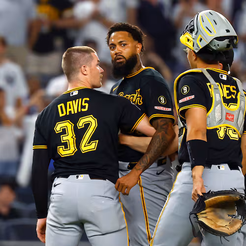 Pittsburgh Pirates catchers Henry Davis (32) and Rafael Flores Jr. keep pitcher Dennis Santana from going after New York Yankees' José Caballero during the ninth inning of a baseball game, Monday, July 20, 2026 in New York. (AP Photo/Noah K. Murray)