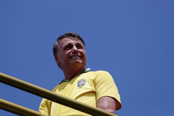 Former President Jair Bolsonaro attends a rally on Copacabana Beach in support of a proposed bill to grant amnesty to those arrested for storming government buildings in an alleged coup attempt in 2023, in Rio de Janeiro, Sunday, March 16, 2025. (AP Photo/Bruna Prado)