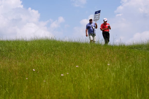 Hyo Joo Kim, of South Korea, walks on the ninth hole during the second round of the Chevron Championship LPGA golf tournament Friday, April 25, 2025, in The Woodlands, Texas. (AP Photo/Ashley Landis)