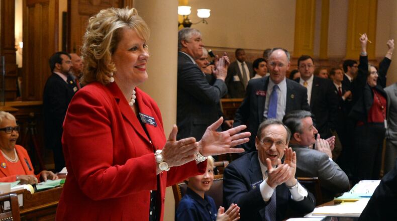 Sen. Renee Unterman celebrates the passage of a medical marijuana bill that included amended language that mandated insurance companies cover autism treatments for children.