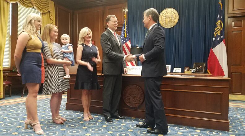 Tucker Mayor Frank Auman is formally sworn in as a member of the Georgia Regional Transportation Authority board.