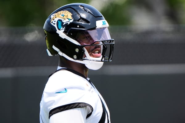Jacksonville Jaguars defensive end Travon Walker prepares for a drill during a team NFL football practice, Monday, May 19, 2025, in Jacksonville, Fla. (AP Photo/John Raoux)