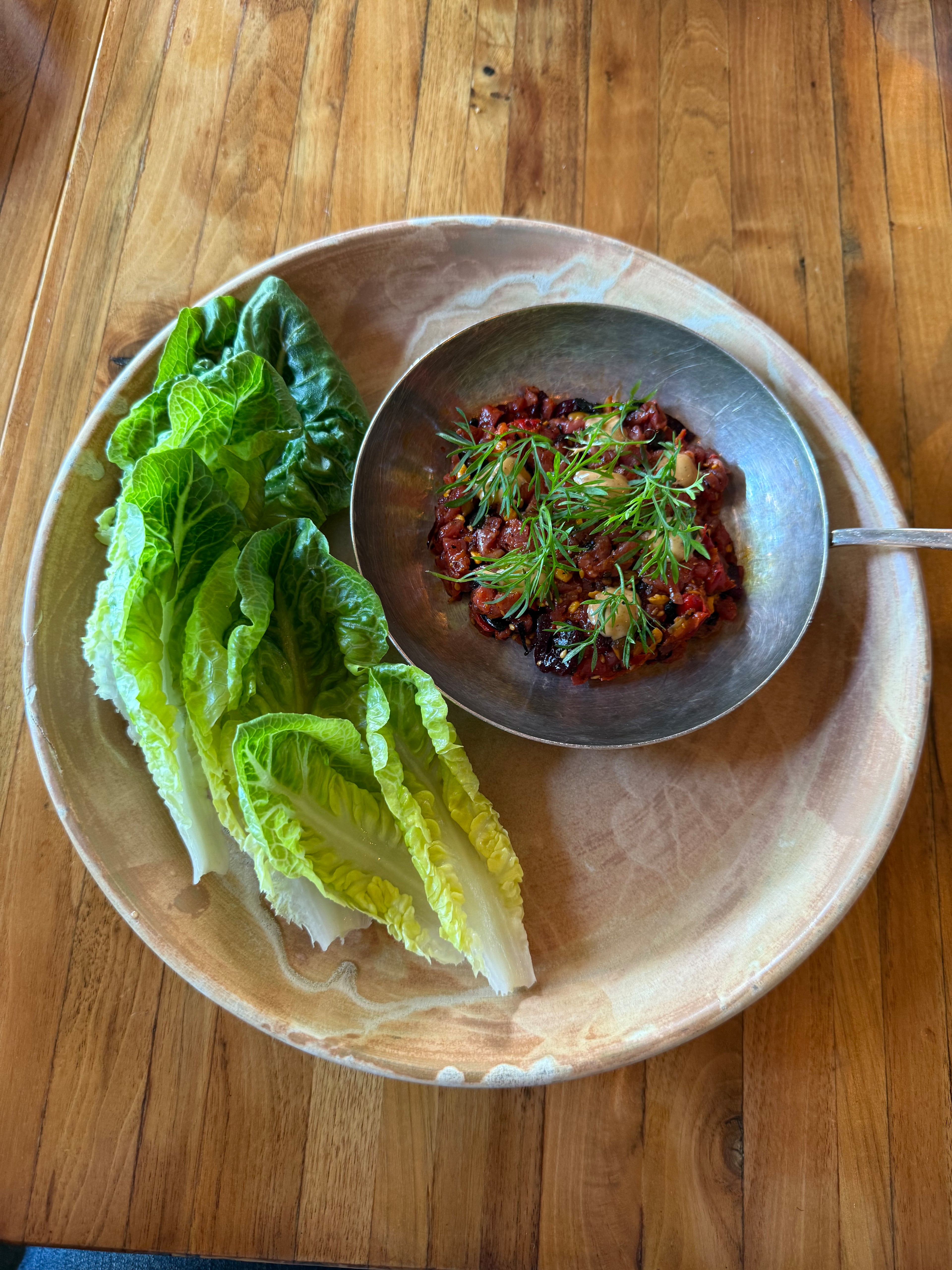 Served with lettuce instead of toast points, the Beef Tartare at Staplehouse is a taste exposion. (Angela Hansberger for the AJC)