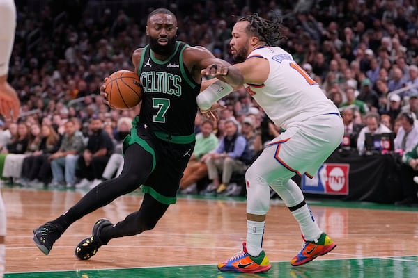 Boston Celtics guard Jaylen Brown (7) drives to the basket against New York Knicks guard Jalen Brunson, right, during the first half of Game 5 of an NBA basketball second-round playoff series, Wednesday, May 14, 2025, in Boston. (AP Photo/Charles Krupa)