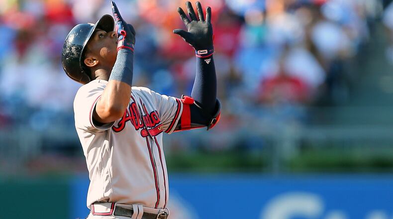 PHILADELPHIA, PA - SEPTEMBER 30: Ronald Acuna Jr. #13 of the Atlanta Braves gestures after hitting an RBI double against the Philadelphia Phillies during the third inning of a game at Citizens Bank Park on September 30, 2018 in Philadelphia, Pennsylvania. (Photo by Rich Schultz/Getty Images)