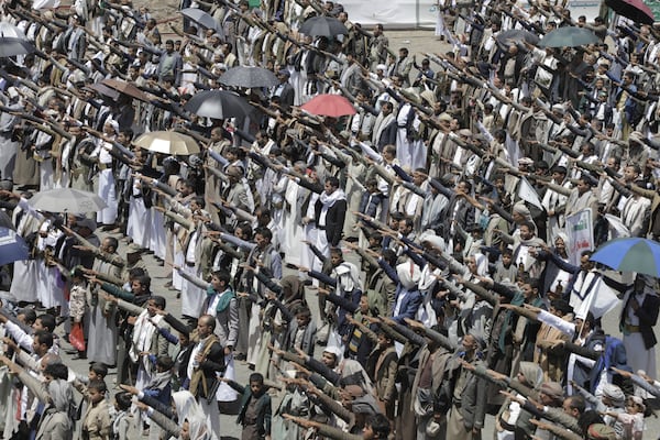 Yemeni Houthis chant religious slogans as they celebrate Eid al-Ghadir, the day on which they believe Islam was completed as a religion by the appointment of Ali as Prophet Muhammad's successor, at Al Imam Ali park in Sanaa, Yemen, Saturday, June 14, 2025. (AP Photo/Osamah Abdulrahman)