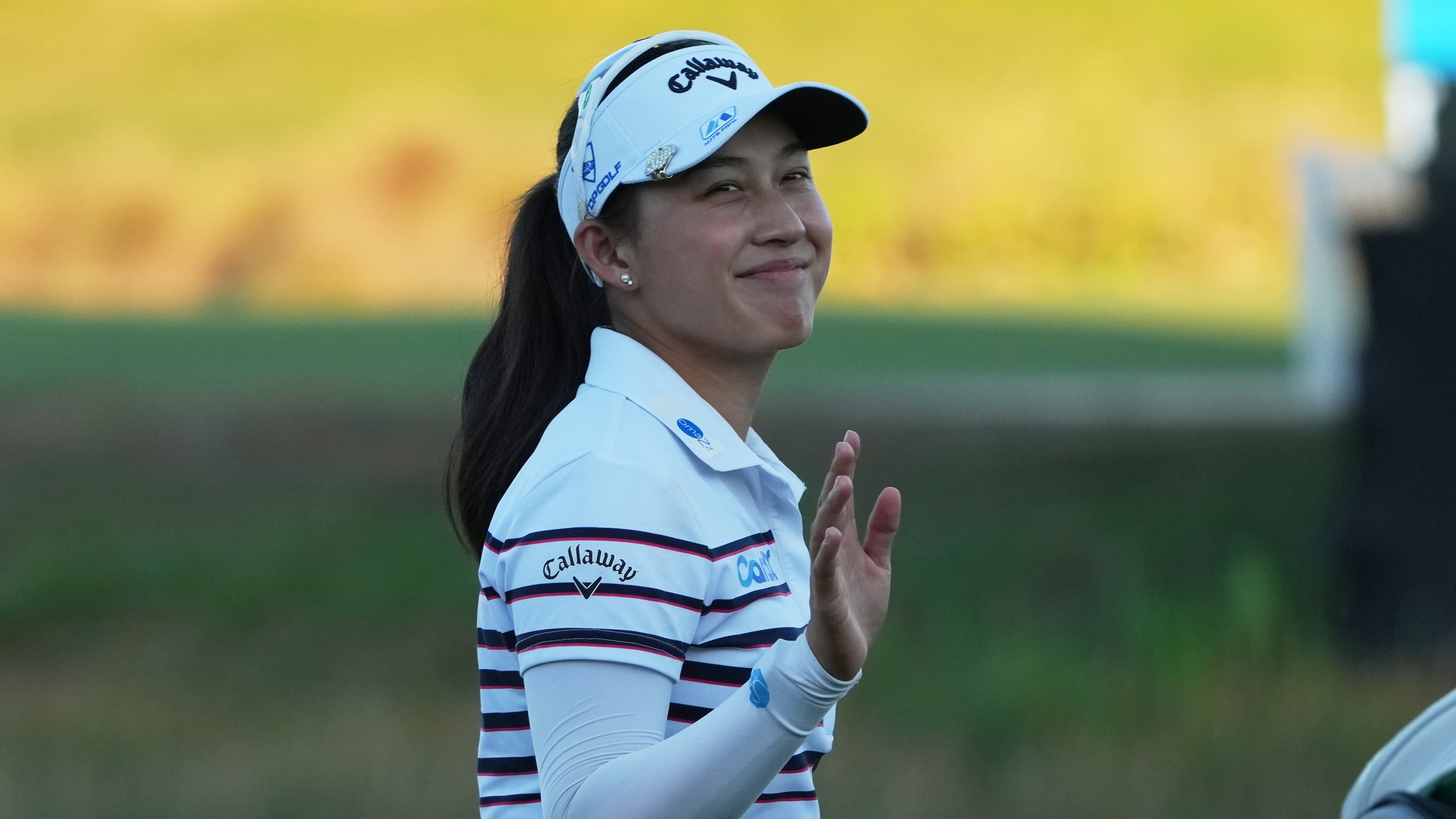 Jeeno Thitikul of Thailand waves as she approaches the 18th green during the third round of the LPGA Tour Championship golf tournament, Saturday, Nov. 22, 2025, in Naples, Fla. (AP Photo/Marta Lavandier)