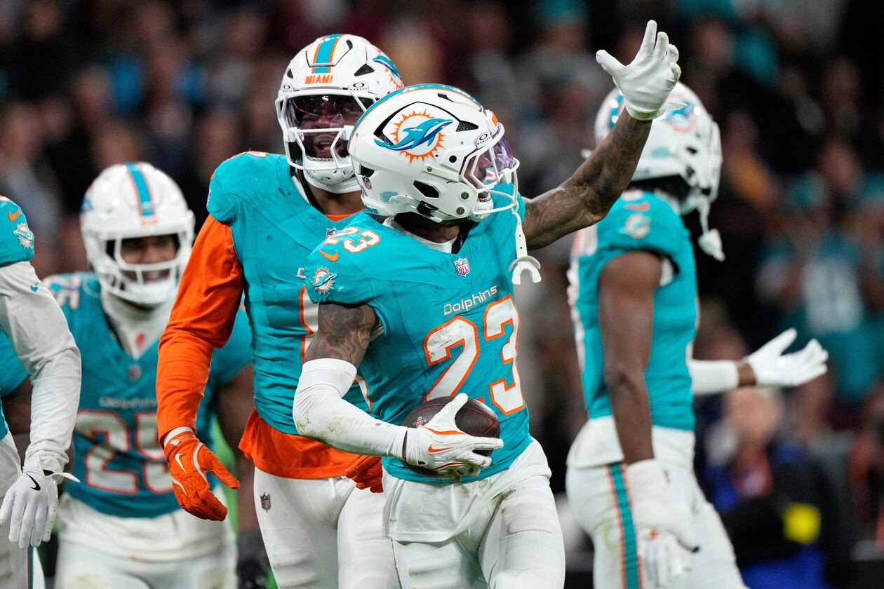 Miami Dolphins cornerback Jack Jones (23) celebrates after making an interception during overtime of an NFL football game between the Washington Commanders and the Miami Dolphins in Madrid, Spain, Sunday, Nov. 16, 2025. (AP Photo/Bernat Armangue)