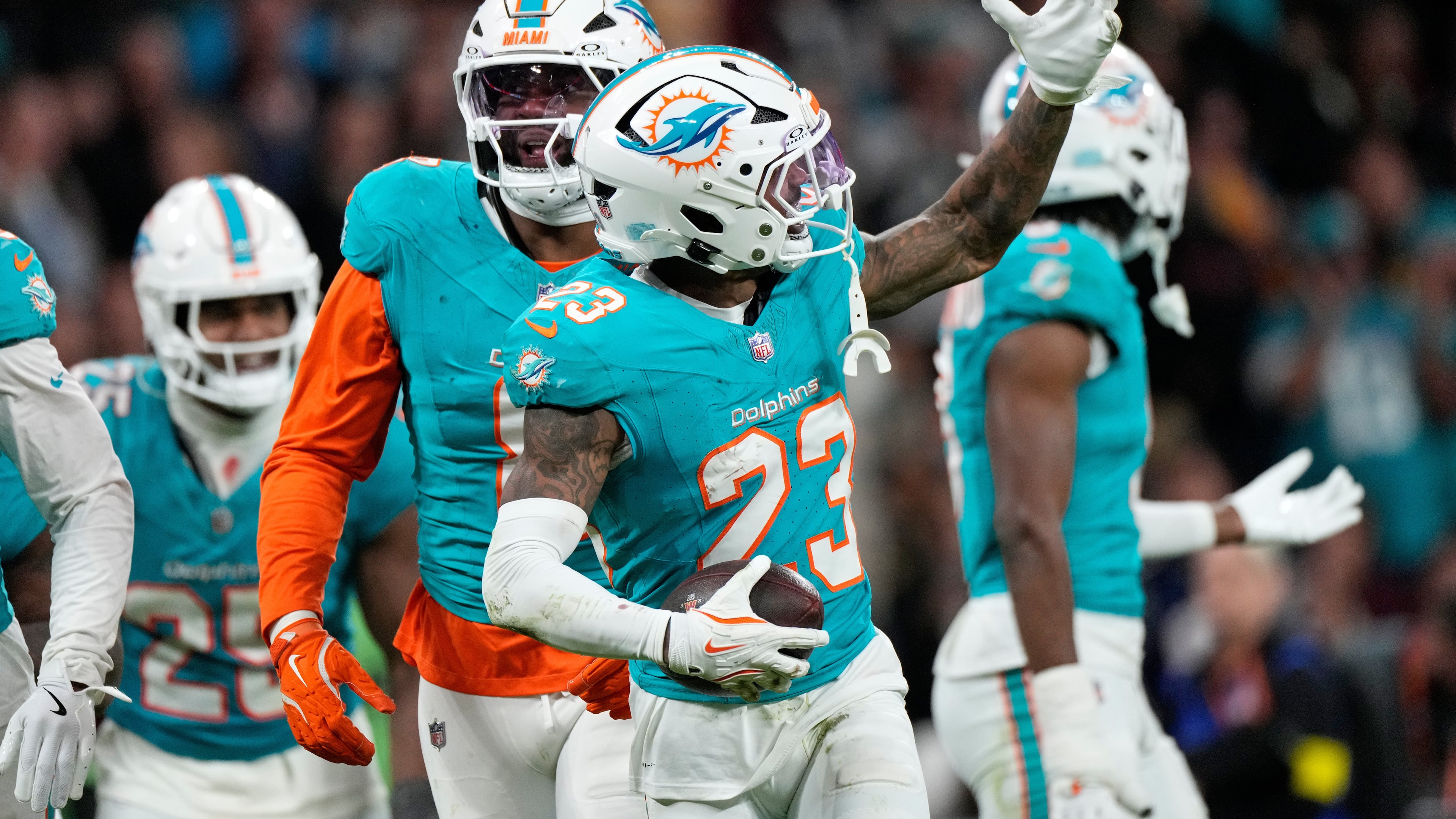 Miami Dolphins cornerback Jack Jones (23) celebrates after making an interception during overtime of an NFL football game between the Washington Commanders and the Miami Dolphins in Madrid, Spain, Sunday, Nov. 16, 2025. (AP Photo/Bernat Armangue)
