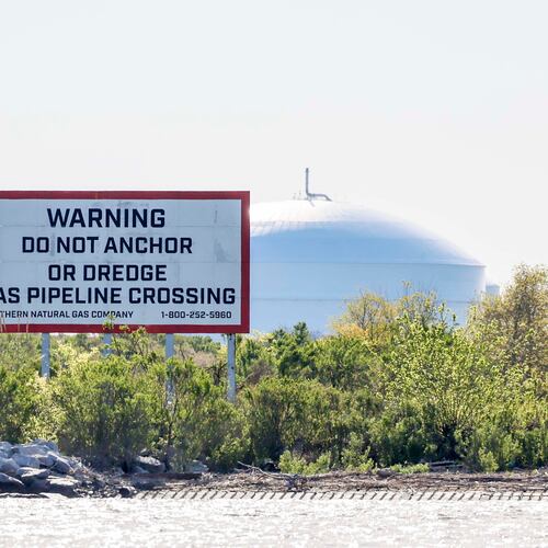 A sign at Elba Island advises ships and boats not to anchor on a gas pipeline crossing the Savannah River. The Elba Island gas export terminal is one of only nine such facilities in the United States and is becoming an increasingly important energy supplier. (Miguel Martinez/AJC)