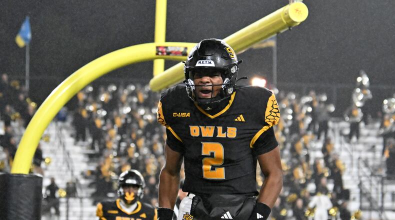 Kennesaw State quarterback Amari Odom set school single-game records for passing yards, total offense and passing touchdowns in a 41-34 Owls win over Missouri State. (Hyosub Shin/AJC)