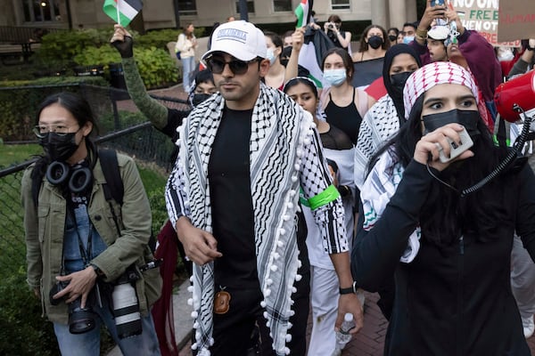 FILE - Mohsen Mahdawi, center, looks on during a pro-Palestinian protest at Columbia University, Thursday, Oct. 12, 2023, in New York. (AP Photo/Yuki Iwamura, File)