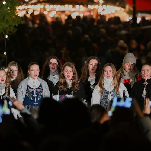 The traditional lighting up ceremony starts, with a choir singing carols, for the annual Norwegian gifted Christmas tree in Trafalgar Square, in London, England, Thursday, Dec. 4, 2025. (AP Photo/Thomas Krych)