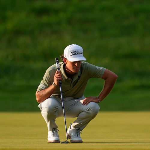Jackson Koivun lines up his ball on the first green during the first round of the St. Jude Championship golf tournament, Thursday, Aug. 13, 2026, in Memphis, Tenn. (AP Photo/George Walker IV)