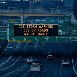 A Georgia Department of Transportation sign warns drivers of ice on roads during an ice storm warning in Atlanta, Georgia, Monday, Jan 26, 2026 (Ben Hendren for the AJC)