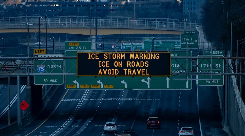 A Georgia Department of Transportation sign warns drivers of ice on roads during an ice storm warning in Atlanta, Georgia, Monday, Jan 26, 2026 (Ben Hendren for the AJC)